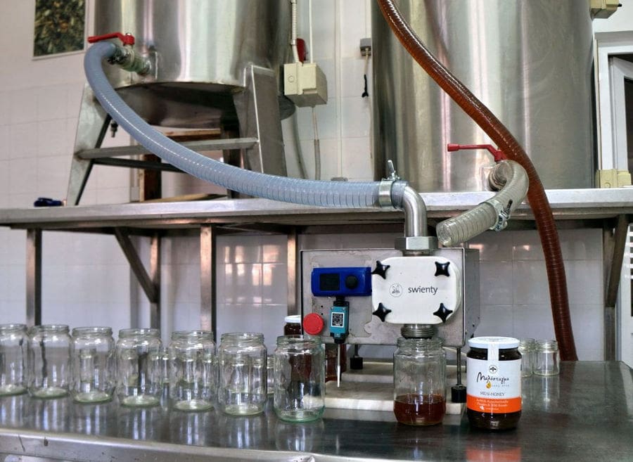 close-up of honey feeling machine working at Melostagma plant